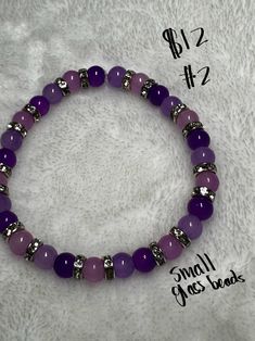 This bracelets is beautifully made with purple and lavender colored small glass beads. It is spaced with silver rhinestone accents and will look beautiful on any wrist. Purple 8mm Beaded Bracelet, Adjustable Amethyst Beaded Bracelets With Round Beads, Purple Polished Round Bead Jewelry, Purple Amethyst Bracelets With 8mm Beads, Adjustable Purple Beaded Bracelets With Faceted Beads, Adjustable Purple Beaded Bracelet With Faceted Beads, Adjustable Purple Beaded Bracelet With Silver Beads, Purple Beaded Bracelet With 8mm Beads, Lavender Bracelets With Colorful Beads