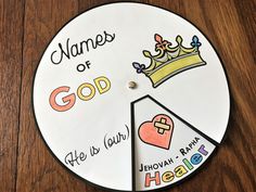 a clock with names of god on it and a heart shaped piece of paper in the middle