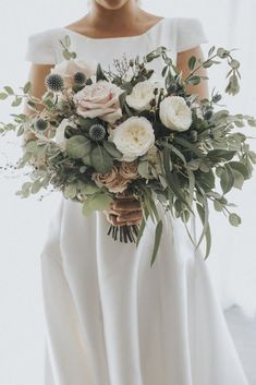 a woman holding a bouquet in her hand on the instagram page for an article