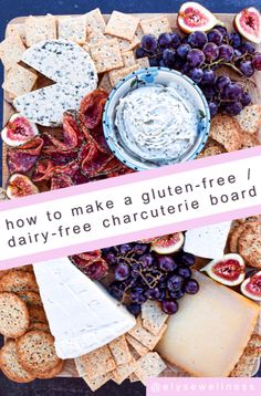 a platter filled with cheese, crackers and fruit