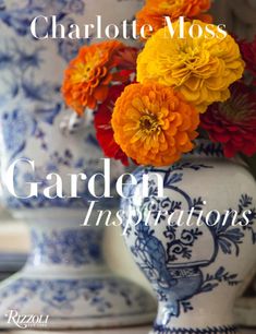 the cover of charlotte moss's garden instructions, with flowers in a blue and white vase