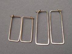 "These simple geometric dangles are shaped to easily insert and have a self closure for security. They're so comfortable you can wear them 24/7, and they go with anything. Hammered for hardness, these 19 gauge earrings are effortless and comfortable. Choose your metal and length in dropdown menu. 1 inch x 3/8\" or 1 1/2 inches x 1/2\". Made to order. Shipping ~ Domestic orders are sent USPS insured first class. Expect 3 to 5 business days for delivery from the date it is mailed. I am a 1-person Minimalist Hammered Rectangular Earrings, Everyday Nickel Free Rectangular Hoop Earrings, Everyday Nickel-free Rectangular Hoop Earrings, Everyday Hammered Rectangular Jewelry, Minimalist Rectangular Hoop Earrings, Hypoallergenic, Minimalist Rectangular Hypoallergenic Hoop Earrings, Minimalist Hypoallergenic Rectangular Hoop Earrings, Gold Minimalist Jewelry, Silver Wire Earrings