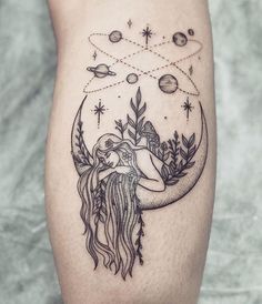 a woman's thigh with an image of the moon and stars above her head