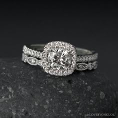 a white gold ring with diamonds on top