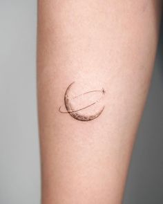 a woman's arm with a small tattoo on the left side of her leg