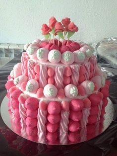 a pink and white cake on a table