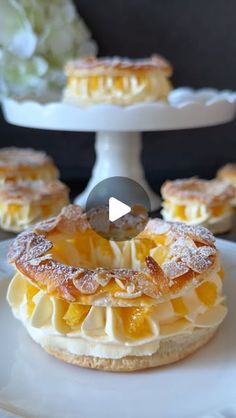 Food with Style on Instagram: "Orange Pastry Rings Recipe 🍊🤍

These delicate puff pastry rings are elegant and bursting with citrus flavor, making them ideal for any occasion. 🥰

📝Ingredients:

(You can choose your preferred ring sizes)

For the pastry:

•	1 roll of puff pastry
•	1 egg yolk (for brushing)
•	Sliced almonds (for sprinkling)

For the orange curd:

•	75 ml (1/3 cup) freshly squeezed orange juice (unsweetened)
•	1 egg yolk
•	30 g (2 Tbsp) sugar (adjust to taste based on the sweetness of the oranges)
•	1 tsp grated orange zest (unwaxed)
•	1 tsp cornstarch (for a thicker consistency)
•	1 tsp butter (room temperature)

For the filling:

•	200 ml (3/4 cup) whipping cream
•	Orange curd (prepared earlier)

For decoration:

•	Orange segments
•	Powdered sugar

🤍 Instructions:

1.