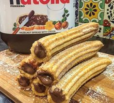 nutella cookies are stacked on top of each other with chocolate toppings and powdered sugar