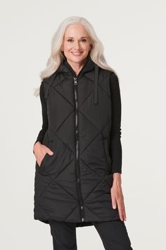 Add a transitional layer to your closet with this versatile and stylish puffer vest. It has a hood, a zip front closure, handy pockets, a sleeveless fit and a sleek longline silhouette dropping to thigh length. Perfect for adding some extra warmth to an outfit. Pair with trainers for a chic off-duty style. Puffer Gilet, Petite Jumpsuit, Petite Coat, Plus Size Coats, Tall Clothing, Stunning Outfits, Tshirt Skirt, Petite Tops, Petite Outfits