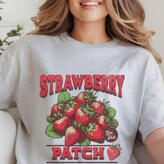 Sweeten Your Style with Our Strawberry Graphic T-Shirt! Add a touch of fruity fun to your wardrobe with our Strawberry Graphic T-Shirt. This delightful tee features a vibrant and playful strawberry design that's sure to brighten your day and bring a smile to everyone you meet. **This design falls into the category of:  Designed by a Seller This design was provided by Kittl The production partner is Printify delivered from RI, US** Comfort Colors introduces the "Comfort Colors 1717" garment-dyed t-shirt; a fully customizable tee made 100% with ring-spun cotton. The soft-washed, garment-dyed fabric brings extra coziness to your wardrobe while the relaxed fit makes it an excellent daily choice. The double-needle stitching throughout the tee makes it highly durable while the lack of side-seams Sweet Strawberry Print Crew Neck Top, Sweet Short Sleeve Tops With Fruit Print, Sweet Fruit Print Tops For Spring, Cute Spring Tops With Fruit Design, Trendy Strawberry Print Cotton Shirt, Sweet Cotton Tops With Fruit Print, Casual Short Sleeve Tops With Fruit Design, Trendy Cotton Shirt With Strawberry Print, Red Fruit Print Graphic Tee