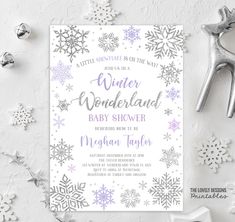 the winter wonderland baby shower is shown with snowflakes and silver foil on it