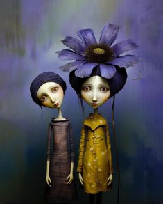 two dolls are standing next to each other and one has a flower on its head