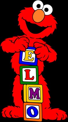 the sesame character is holding blocks with letters