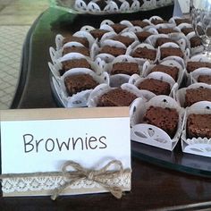 there are many brownies in the trays on the table and one is for sale