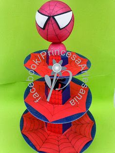 a spiderman cake with scissors on top