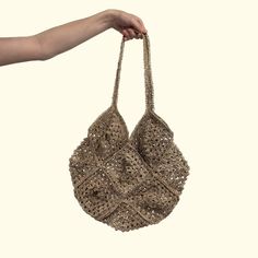 Intertwined's hemp crocheted market bags are the epitome of sustainable style! Handcrafted with care, these bags are meticulously crocheted using high-quality hemp fibers. Embrace eco-consciousness as you shop, knowing that hemp is a renewable resource that requires minimal water and no pesticides to grow. Our market bags are not only sturdy and durable but also incredibly versatile, capable of carrying your groceries, beach essentials, or everyday items with ease. With their intricate crochet p Fair Trade Everyday Jute Bags, Eco-friendly Hemp Bag In Natural Color, Eco-friendly Hemp Bags In Natural Color, Eco-friendly Natural Hemp Bag, Natural Color Crochet Bag For Everyday Use, Eco-friendly Fair Trade Beige Shoulder Bag, Eco-friendly Beige Burlap Straw Bag, Fair Trade Jute Crochet Bag For Everyday, Fair Trade Jute Crochet Bag For Daily Use