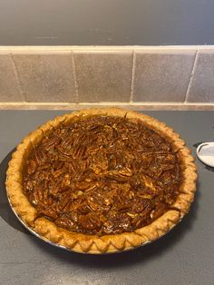 a pecan pie sitting on top of a counter