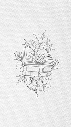 an open book with flowers and leaves on it, in the middle of a drawing