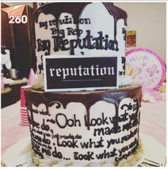 the cake is decorated with chocolate frosting and has words on it that spell out congratulations