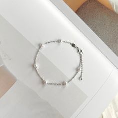 If you are interested in placing a bulk order (50+ pieces), please message us for special pricing.--Dainty pearl bracelet, gold pearl bracelet, minimalist chain bracelet, 925 sterling silver bracelet, pearl jewelry, bridesmaid gifts-- ► DETAILS  -925 sterling silver + white gold/14k gold -pearls -Length: 6 inches + 2 inches chain extender ►Heavenly Materials Our jewellery pieces are delicately handcrafted with gold-fill, sterling silver, stainless steel and gold-plating, combining rich, warm ton Gift White Gold Bracelet With Pearl Drop, Sterling Silver White Gold Bracelets With Pearl Chain, Dainty Sterling Silver Pearl Bracelet, White Gold Sterling Silver Bracelets With Pearl Chain, White Gold Sterling Silver Bracelet With Pearl Chain, Elegant Sterling Silver Bracelet With Pearl Charm, Elegant Sterling Silver Bracelet With Pearl Charm Gift, Minimalist Sterling Silver Pearl Bracelet, Dainty Sterling Silver Bracelets With Pearl Charm