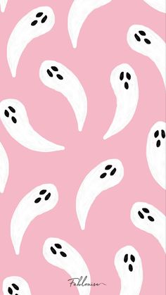 a pink background with black and white ghost faces