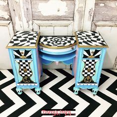 two blue and white tables sitting on top of a black and white checkered floor