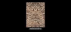 an animal print rug with zebra stripes on the front and back, against a black background