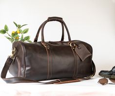 "Handmade Item %100 Genuine Leather - Best Quality Oil-Tanned Full Grain Cowhide Duffle Bag, Travel Bag, Personalized Groomsmen Gift, Custom Leather Holdall Bag, Leather Personalized Gift, Mens Duffle Bag, Father's Day Gift, Birthday Gift, Gift for Him Size XL Duffle Bag: Has separate shoe compartment Approx. 21\" x 11\" x 11\" inches Small Duffle Bag: Don't have shoe compartment Approx. 16\" x 9\" x 9\" inches Color Options: Light Brown, Black and Dark Brown PERSONALIZATION INSTRUCTIONS Please Mens Overnight Bag, Groomsmen Gift Bags, Mens Duffle Bag, Small Duffle Bag, Leather Holdall, Leather Anniversary Gift, Large Travel Bag, Leather Duffel Bag, Holdall Bag