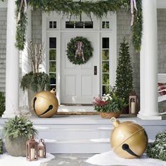 christmas decorations on the front porch of a house