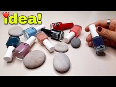 someone is holding some rocks and nail polish in front of their nails with the words idea