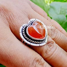 "Welcome in KSBJewels --------------------------------------------------------------------------  Title : Heart Carnelian Silver Ring, Natural Carnelian Ring, Minimalist Carnelian Ring, Silver Carnelian Ring, Boho Ring, Red Carnelian Jewelry -------------------------------------------------------------------------- Special offers for you :-  1) If you want to Buy BULK QUANTITY products from us, We can make *SPECIAL OFFER* for you. [BUY 50 GET 10 FREE] -------------------------------------------------------------------------- NOTE :- STONE MAY BE LITTLE DIFFERENT and MEASUREMENTS & WEIGHT are CLOSE to APPROXIMATES. \"It'll look beautiful when you wear it\" Meterial-925 Sterling Silver Click Here to visit my Home Page:- https://www.etsy.com/in-en/shop/KSBJewels?ref=seller-platform-mcnav I gl Handmade Orange Carnelian Rings, Orange Carnelian Rings For Gifts, Carnelian Orange Rings For Gifts, Multiple Rings, Red Carnelian, Carnelian Jewelry, Sports Jewelry, Carnelian Ring, Ring Minimalist