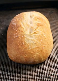 a loaf of bread sitting on top of a baking pan