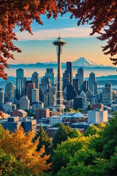 the seattle skyline is seen through trees with mountains in the background