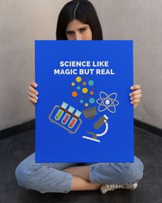 a woman sitting on the floor holding up a sign that says science like magic but real