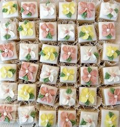 many small square cakes with flowers on them