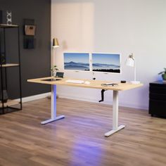 a desk with two computer monitors on it