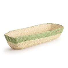 a green and white basket sitting on top of a table