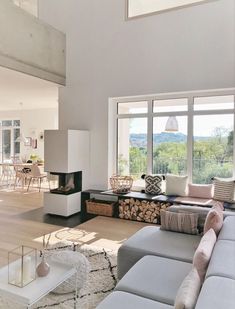 a living room filled with furniture and windows