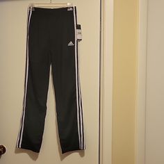 Nwt: Adidas Track Pants 3-Stripes And Adidas Trefoil Logo Regular Fit Drawstring Elastic Waistband Side Pockets Comfy And Sporty Style Show Off Classic Adidas Design. Size: L (14-16) Color: Black And White Smoke Free And Pet Free Home Full Length Athleisure Pants With Three Stripes, Sports Wide Leg Pants With Three Stripes, Wide Leg Sports Pants With Three Stripes, Adidas Stretch Pants With Three Stripes, Hockey Pants, Soccer Pants, Adidas Bottoms, Adidas Sweats, Boy Sweatpants