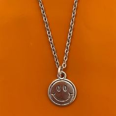 Silver Smiley Face Necklace ⭑ Water Safe & Tarnish Free Chain ⭑ Available in 3 Different Lengths ⭑ Chain Material - Stainless Steel ⭑ Charm Dimensions - 16mm x 13mm ⭑ UK SHIPPING - Shipping to the UK is completely free with no minimum spend requirement. ⭑ INTERNATIONAL SHIPPING - Shipping to everywhere else in the world is just £3. Any additional items ordered within the same order are shipped with no extra shipping charge. Smily Face Necklaces Sliver Chain, Smile Necklaces, Smiley Face Necklace, Face Necklace, Silver Chain For Men, Happy Face, Silver Man, Smiley Face, Last Minute Gifts