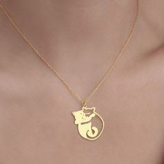 Elevate your accessory collection with the enchanting Cuddling Cats Necklace from Sussex Home. This meticulously handcrafted pendant features two entwined cats, symbolizing companionship and love, making it an ideal gift for bridesmaids, friends, or simply to treat yourself. 

- Material: Sterling Silver, Gold Plated
- Color: Gold
- Gender: Female
- Age Group: Adult

Crafted with precision in our workshop, this necklace boasts a gold-plated finish that adds a touch of elegance to any outfit. To Gold Jewelry With Cat Design For Mother's Day, Mother's Day Gold Jewelry With Cat Design, Valentine's Day Gold Cat Design Jewelry, Gold Cat Design Charm Necklace As Gift, Gold Charm Necklace With Cat Design As Gift, Gold Charm Necklace With Cat Design For Gift, Elegant Cat Design Necklace For Anniversary, Mother's Day Jewelry With Cat Design For Gift, Valentine's Day Gift Necklace With Cat Design