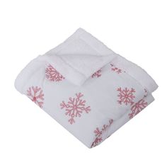 a white blanket with pink snowflakes on it