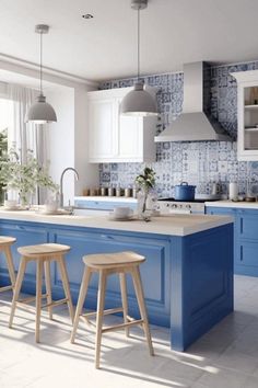 a kitchen with blue cabinets and stools