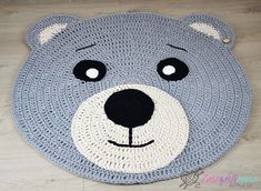 a crocheted bear rug is shown on the floor