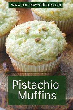 three muffins sitting on top of a wooden board with the words pistachio muffins