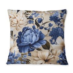 a blue and white pillow with flowers on it