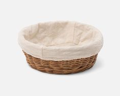 a brown and white basket sitting on top of a table