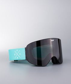 a pair of ski goggles sitting on top of a table