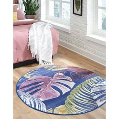 a blue and pink rug in a bedroom