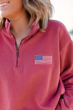 Most sizes and colors are available to ship next day! God bless the USA! These vintage inspired embroidered American flags are perfect for showing your patriotism this summer at your Fourth of July celebrations! Embroidered on your choice of a Comfort Colors pocket tank, tee, long sleeve, or quarter zip! Comfort Colors is unisex sized. This means the sizing is boxy, not fitted like women's, but it is not oversized. It is true to size. Tank Specifications: 6.1 oz., 100% ring spun cotton Soft-wash Red Embroidered Tops For Fall, Red Tops With Embroidered Logo For Fall, Casual Long Sleeve T-shirt With Flag Print, Cotton Crew Neck Sweatshirt With Flag Print, Pink Embroidered Tops For College, Fall Crew Neck Tops Made In Usa, Casual Fall Tops With Flag Print, Casual Tops With Flag Print For Fall, Casual Flag Print Tops For Fall